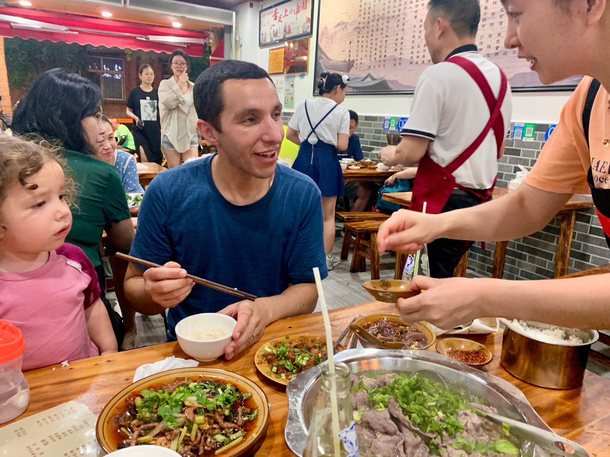 Street food stall in Chengdu — noodles and dumplings