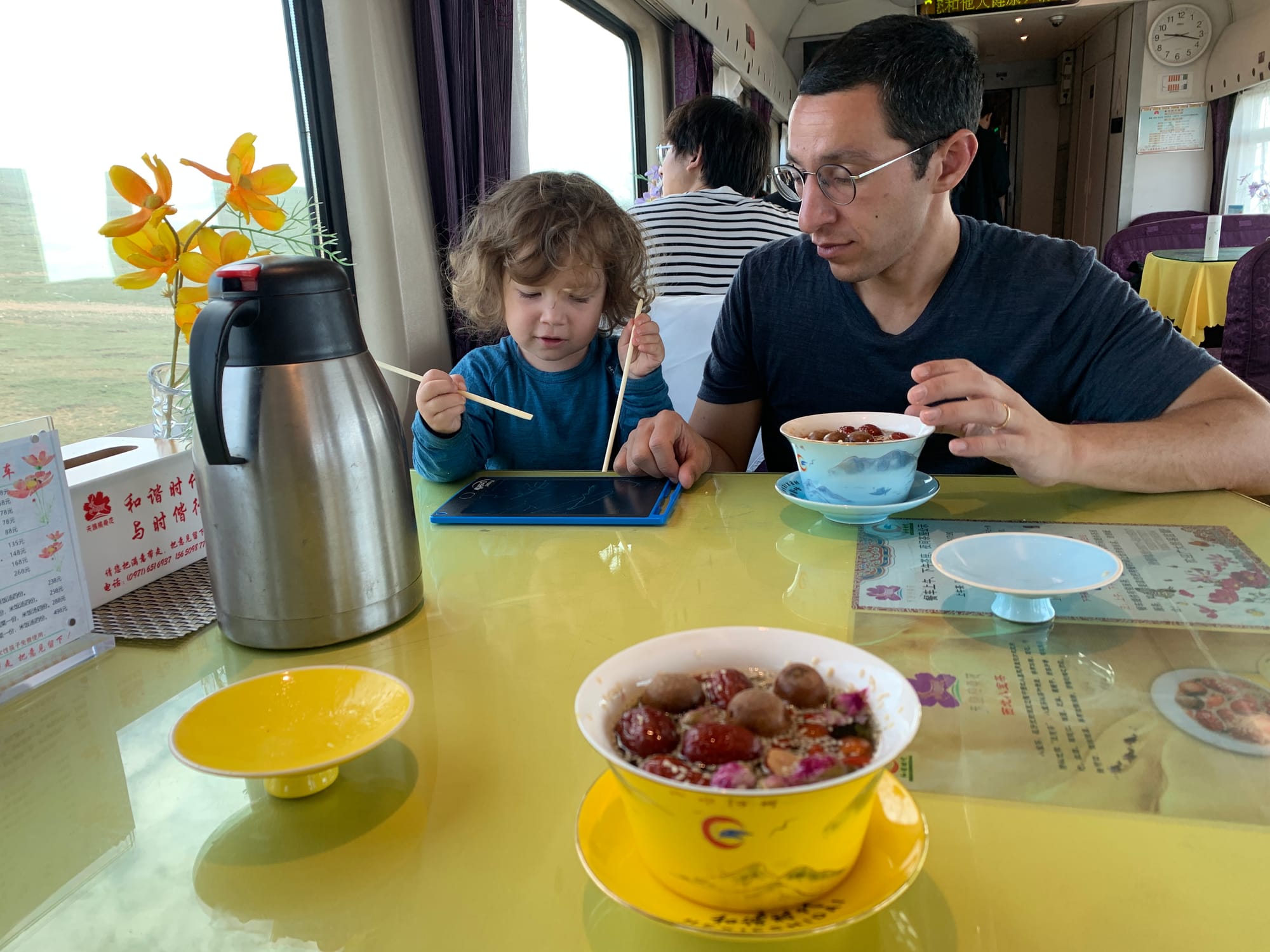 Enjoying eight treasure tea in the restaurant carriage of the Qinghai-Tibet train