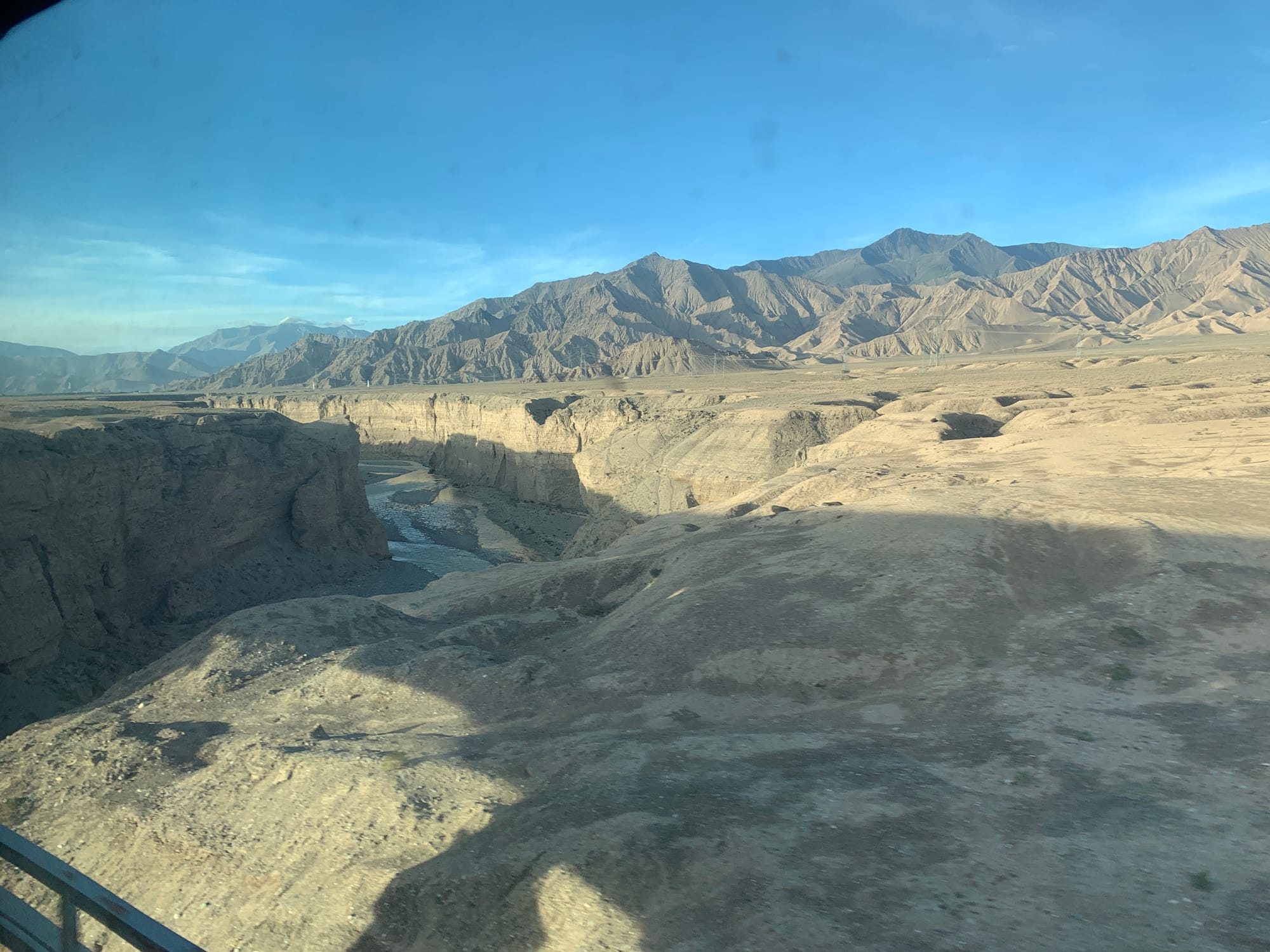 Tibetan Plateau landscape with distant mountains viewed from the train to Lhasa