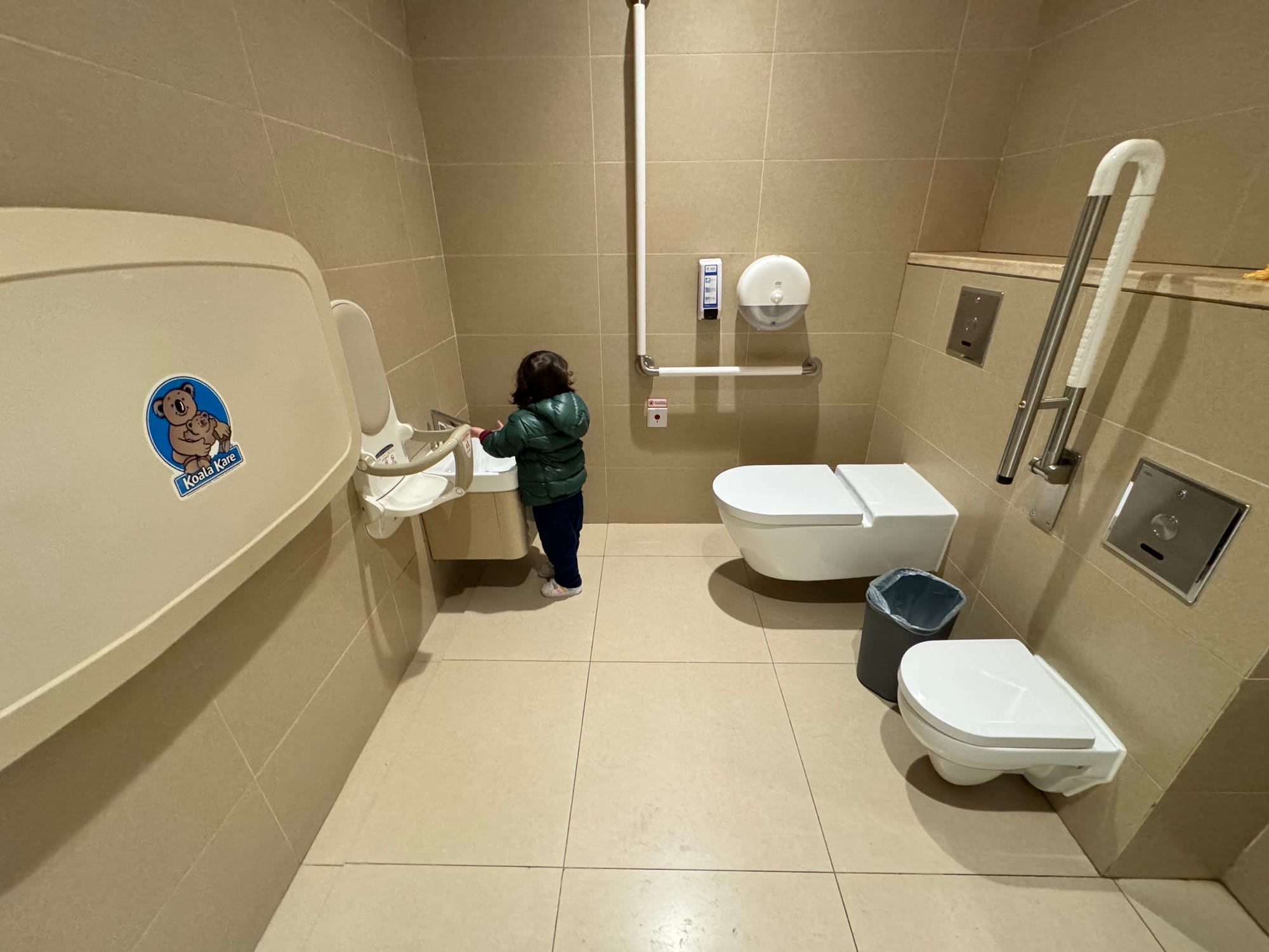 Family restroom in a Chongqing shopping mall with children's toilet and adult toilet