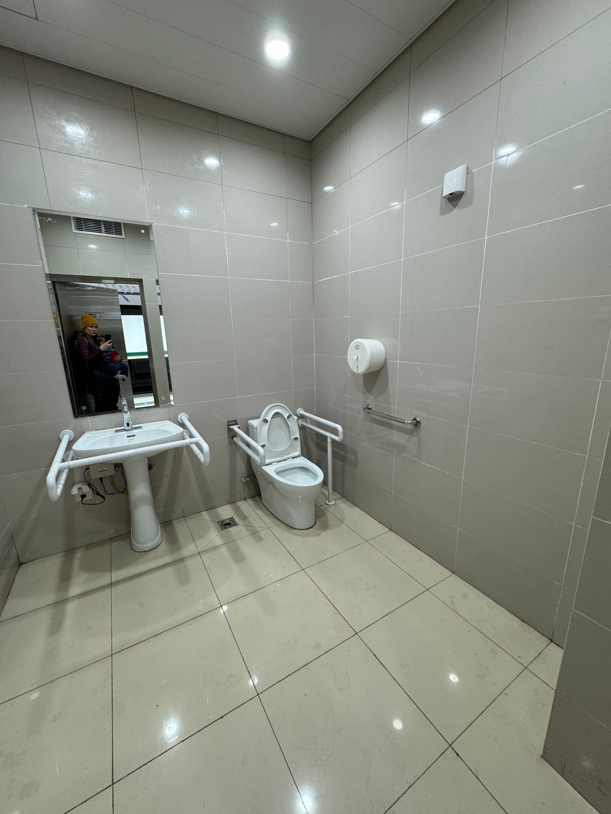Accessible Western-style toilet stall in a Chongqing metro station