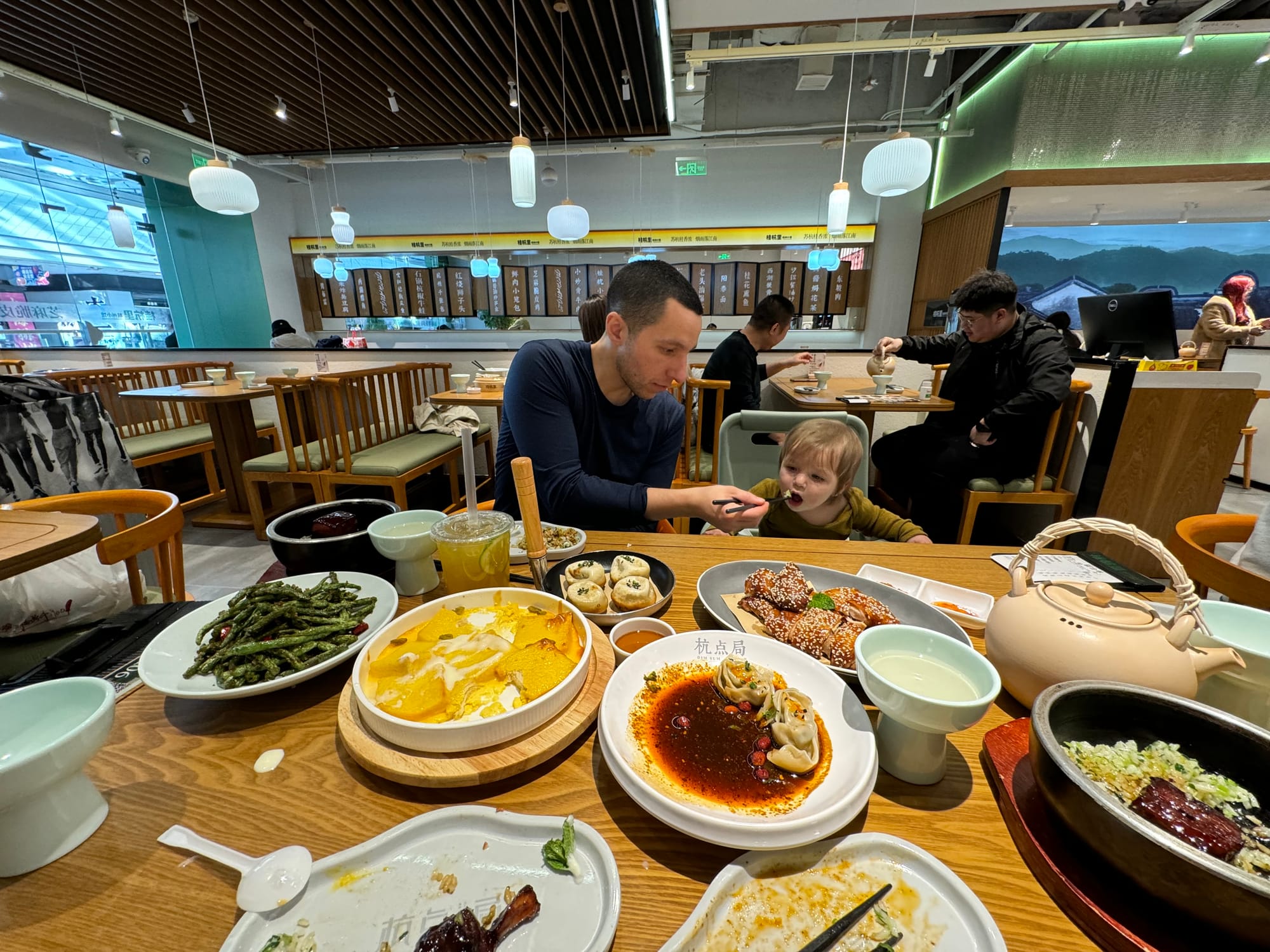 Indoor food hall in a Chinese city with many stalls and seating areas