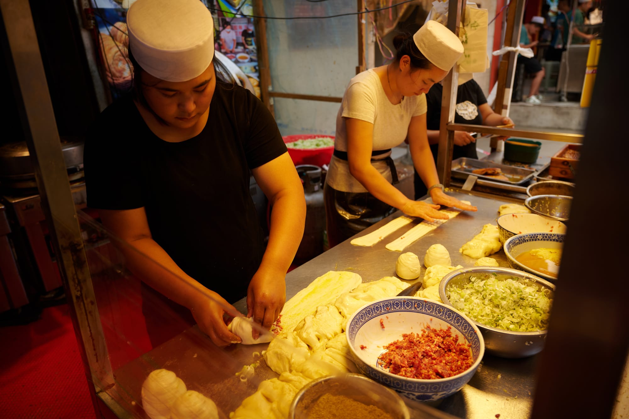 Locals queuing for street food in Xi'an's Muslim Quarter