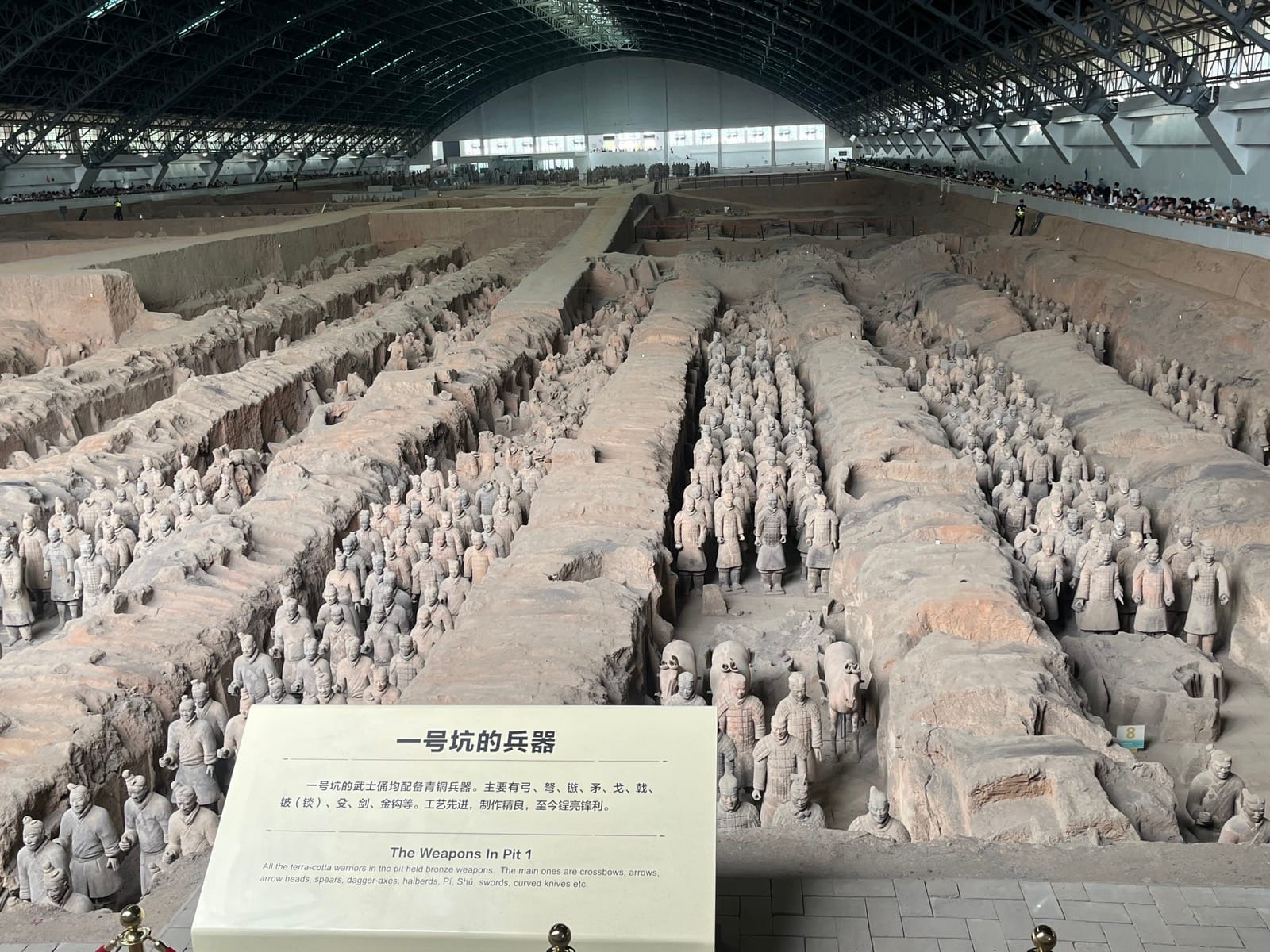 Rows of life-size terracotta warriors in Pit 1 at the museum near Xi'an