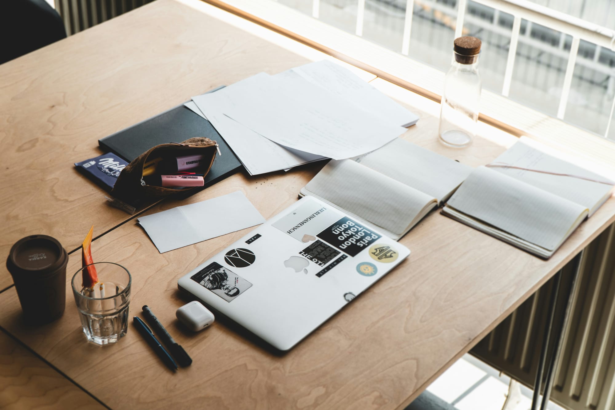 work desk of a content producer - Social Media Automation Tools