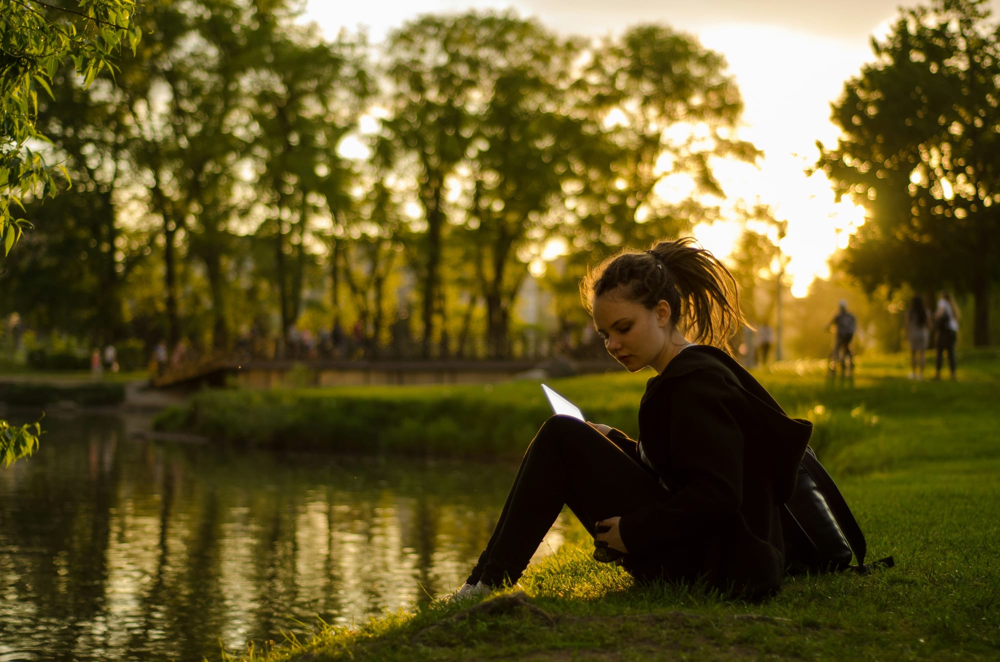 woman working by the lake - content distribution platforms