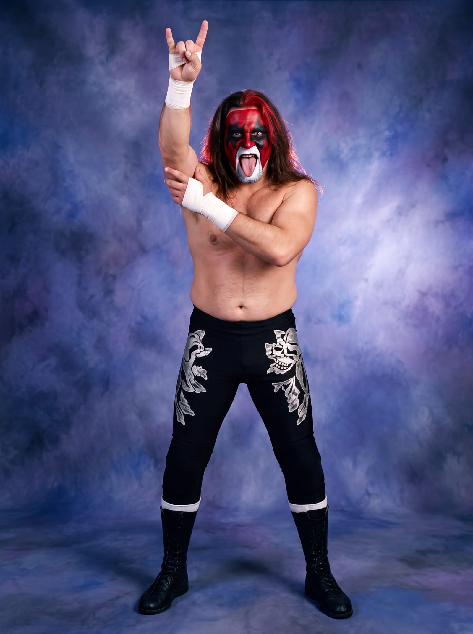 Scott Darkness in red, black and white face paint and black tights with a silver skull design, one taped fist raised overhead making the heavy metal horns, his other hand gripping that arm.