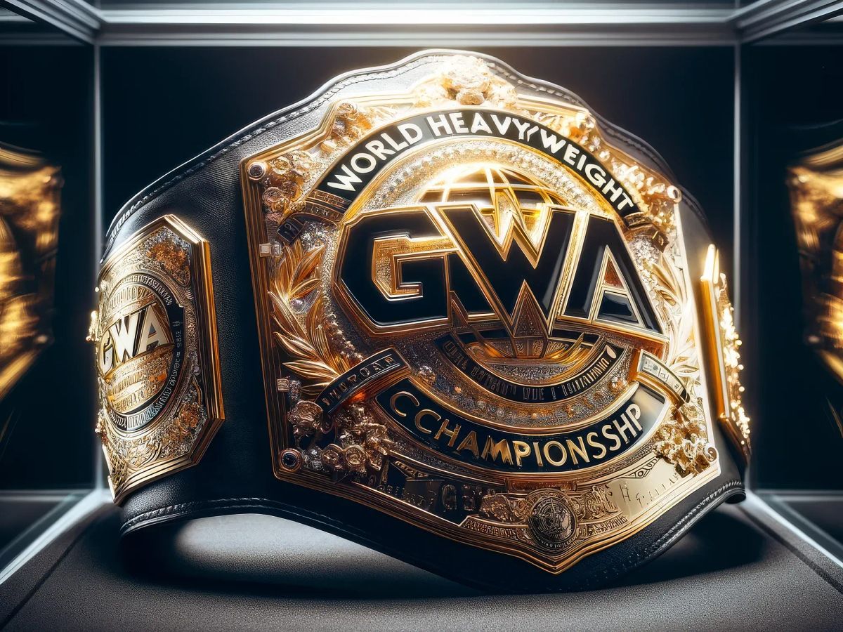 GWA World Heavyweight Championship belt displayed in a lit case, featuring gold and black metalwork with ornate decorative details.
