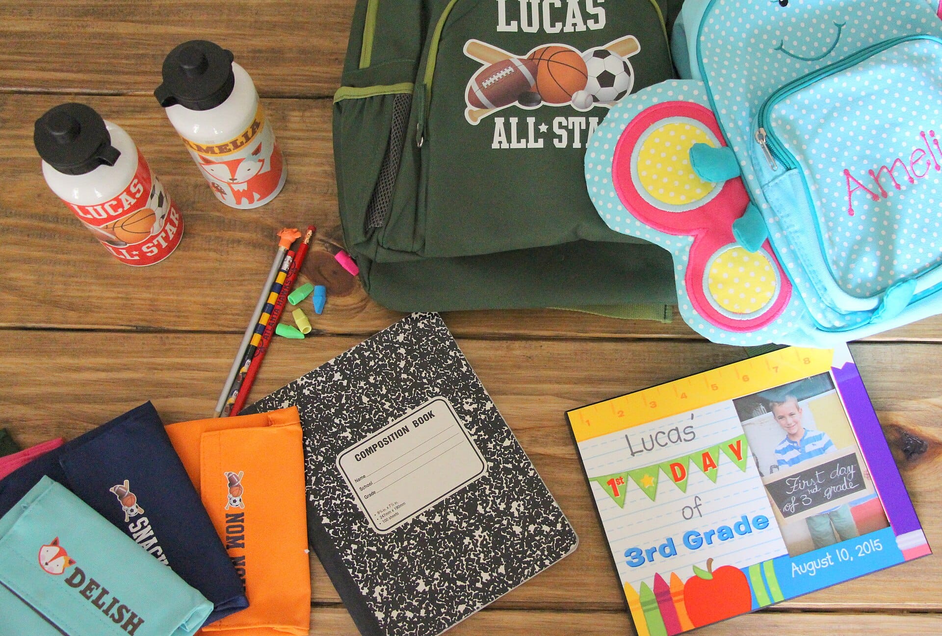 Back-to-school supplies including a backpack, notebook and water bottle