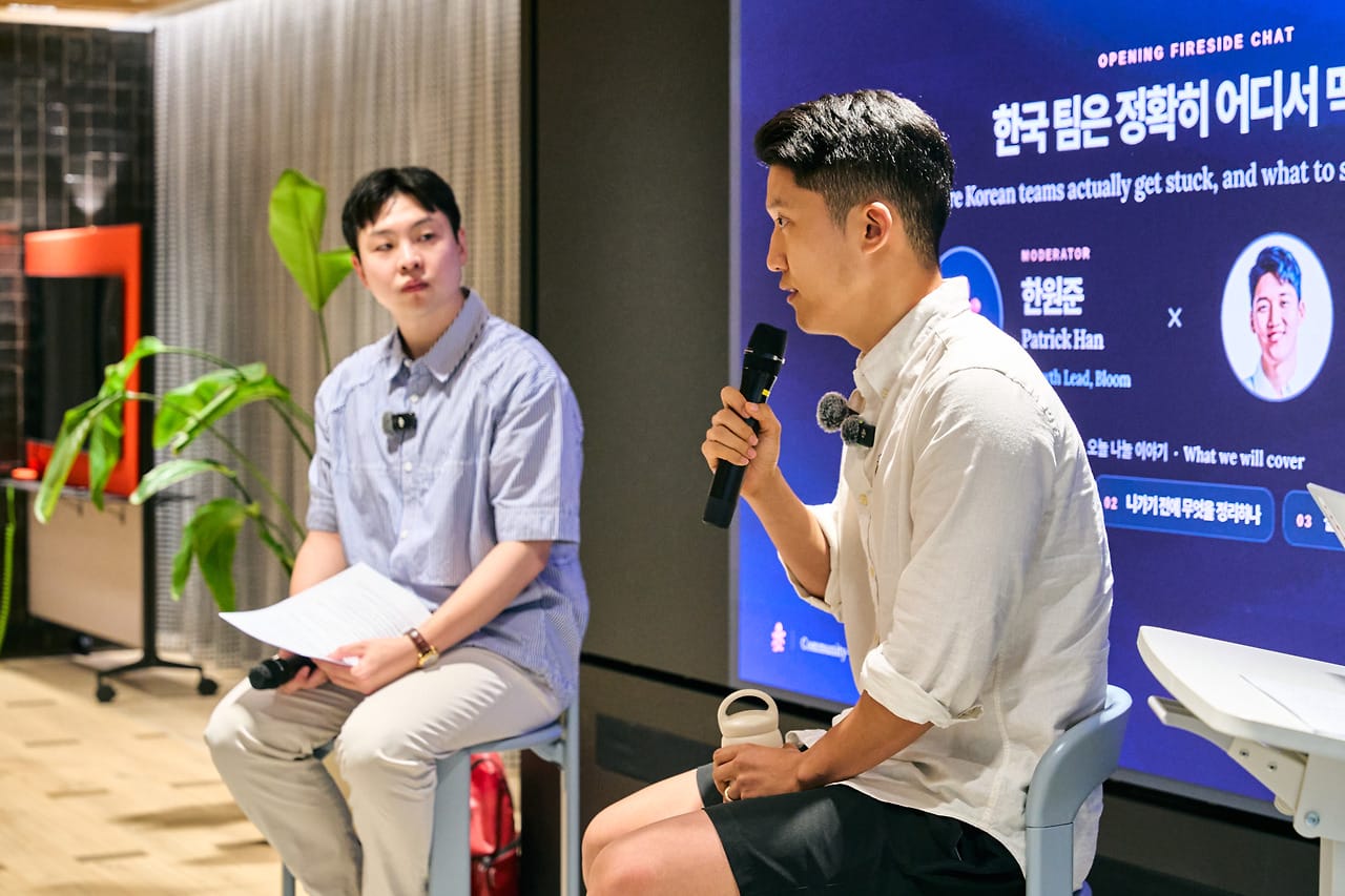 The host and Peter Shin facing each other mid-conversation