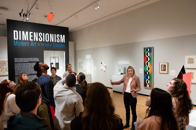Vanja Malloy (pictured on the center) curated the Dimensionism exhibition in 2018. Her choice of location at the University of California, Berkeley, was deliberately near Silicon Valley’s tech startups in hopes of having more cross-disciplinary conversations. (source: Amherst)