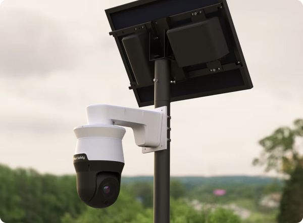 image of a flock camera mounted on a pole with a small solar panel