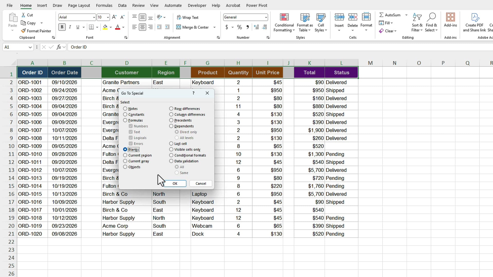 Excel Go To Special dialog box with the Blanks option selected and the mouse pointer on OK