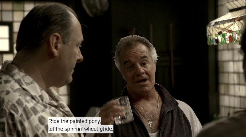 Paulie Walnuts toasting Johnny Sack with lyrics from BS&T's "Spinning Wheel": "Ride the painted pony, let the spinnin' wheel glide."
