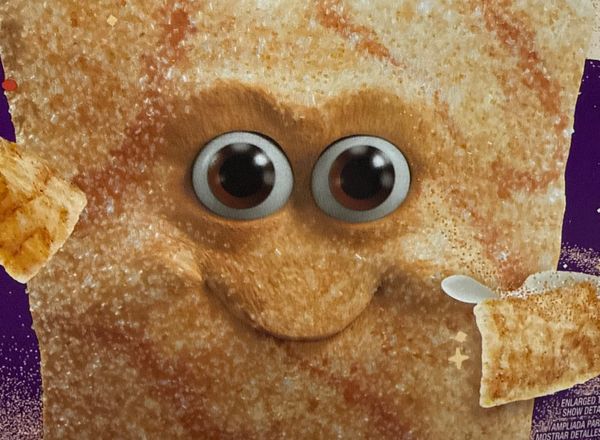 A creepy Cinnamon Toast Crunch face from a box that is CGI (not illustrated). It has intense eyes and a creepy smirk.