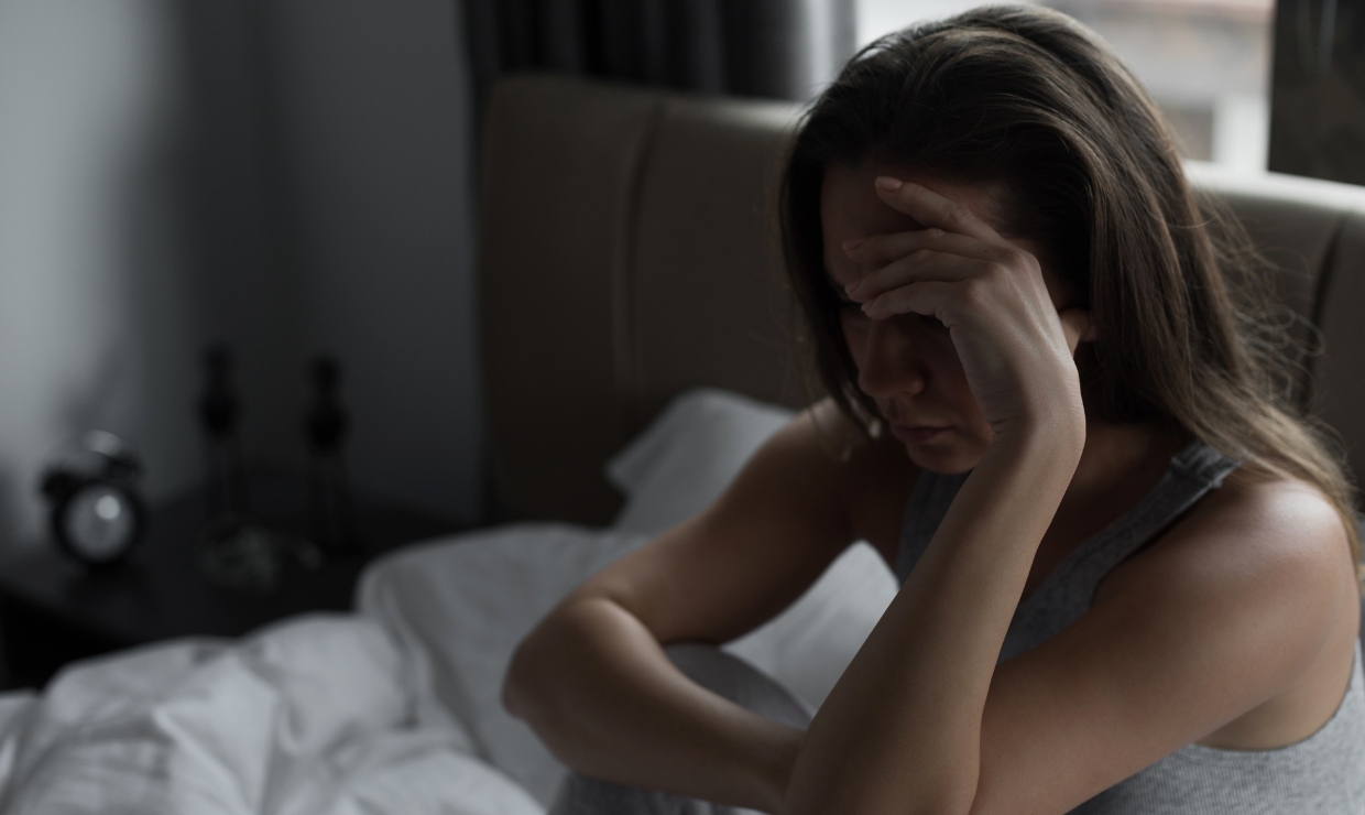 Sad woman sitting in dark room