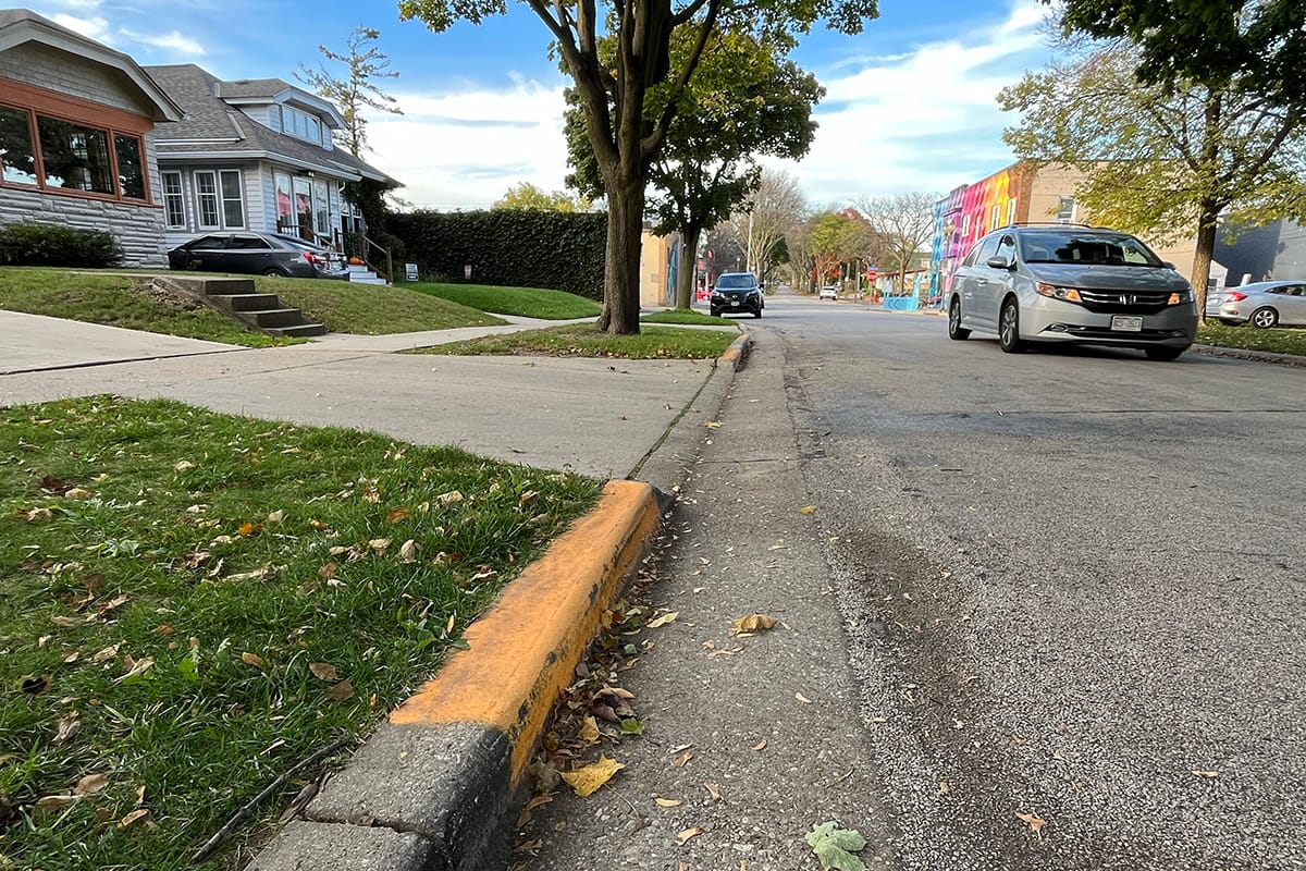 City proposal would help residents pay to paint curbs in no-parking zones by driveways