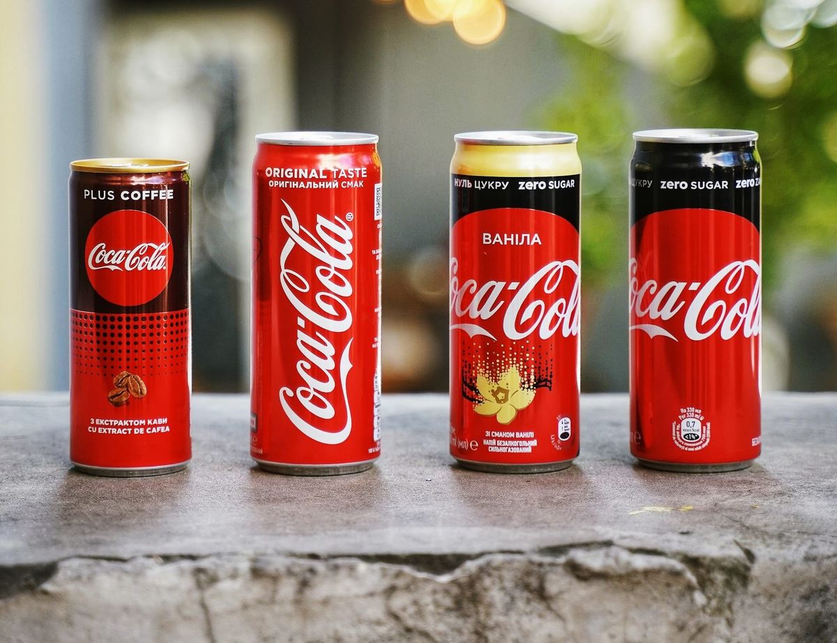 Coca-Cola bottles illustrating KO stock surge after earnings beat