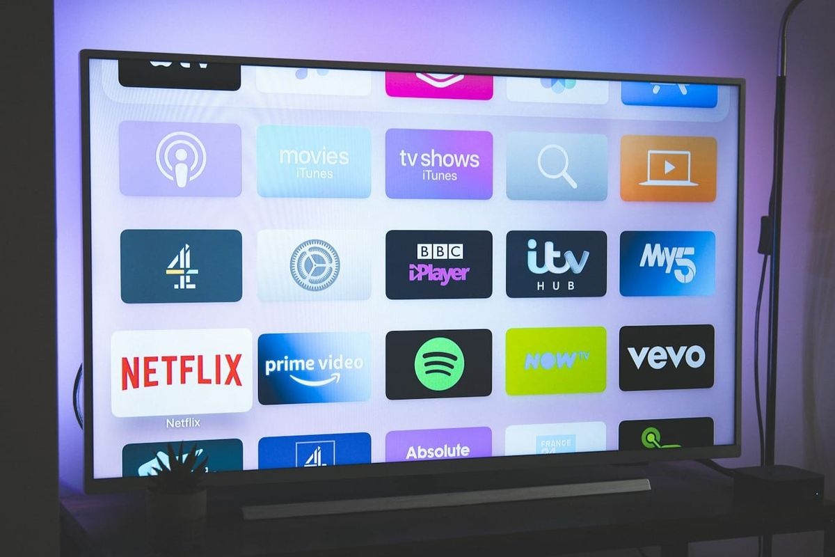 Roku streaming interface and remote highlighting growth in advertising and subscription revenue