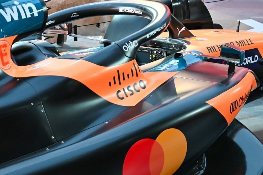 Cisco AI infrastructure logo displayed on Formula 1 car representing networking growth and hyperscaler demand sending CSCO stock higher after earnings