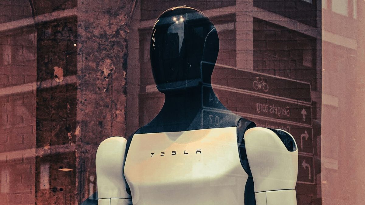 Tesla logo reflecting earnings pressure and investment in autonomous driving and Optimus robotics