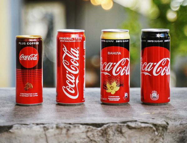 Coca-Cola bottles illustrating KO stock surge after earnings beat
