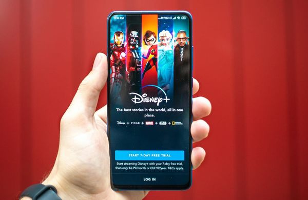 Disney logo with streaming and theme park imagery representing earnings growth and stock rally