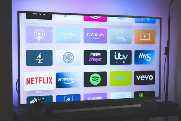 Roku streaming interface and remote highlighting growth in advertising and subscription revenue