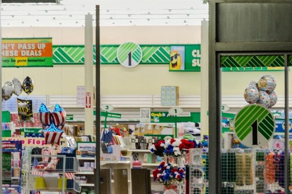 Dollar Tree storefront with discount retail signage and shoppers entering store