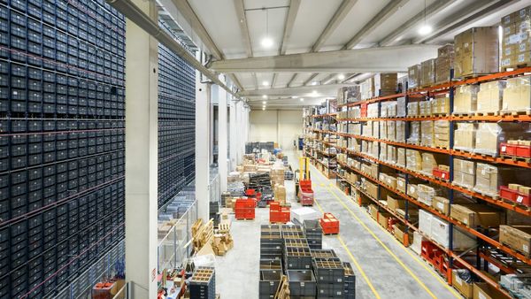 E-commerce packages moving through a warehouse and logistics network