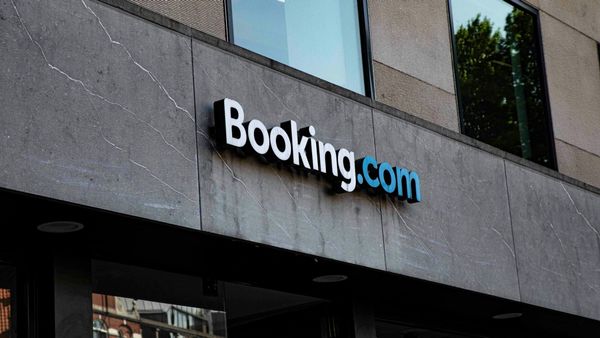 Traveler booking accommodations online as Booking Holdings reports strong quarterly results.