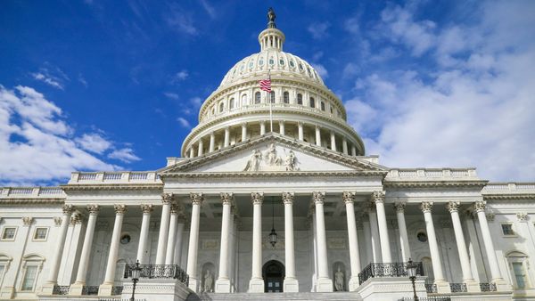 U.S. Capitol with stock market charts ahead of the 2026 midterm elections