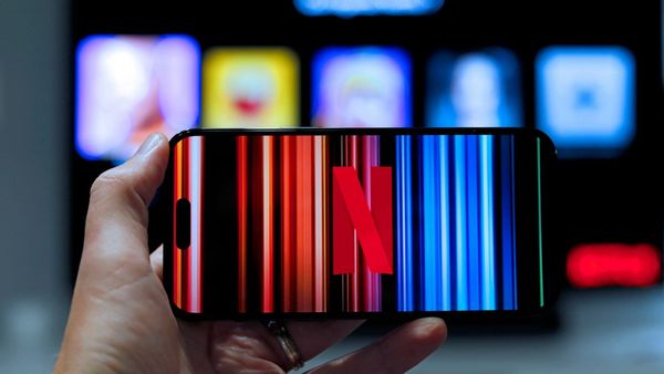 Netflix logo on a television screen as shares decline following weaker revenue and advertising guidance