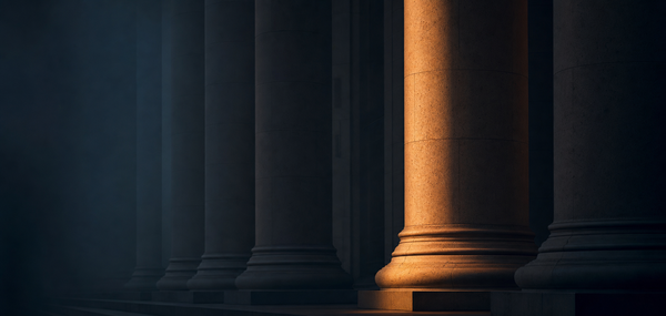 Great Hall of the People stone columns receding into shadow with a single amber-lit column, dark navy editorial photograph