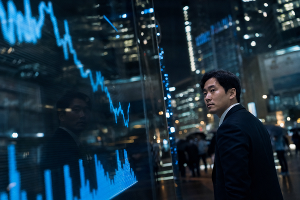 Seoul financial district at night with a reflected market chart and a subdued blue glow