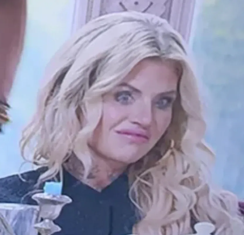 A zoomed-in version of the first photo, highlighting Carolyn's face looking horrified and disgusted, presumably at Sandoval standing behind her