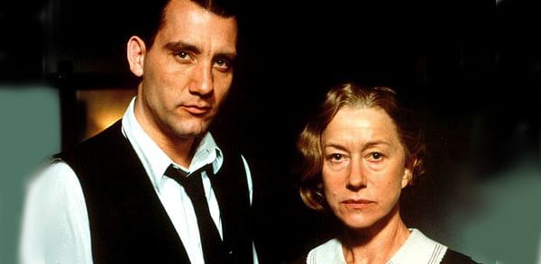 Clive Owen and Helen Mirren staring into camera, in a scene from Gosford Park