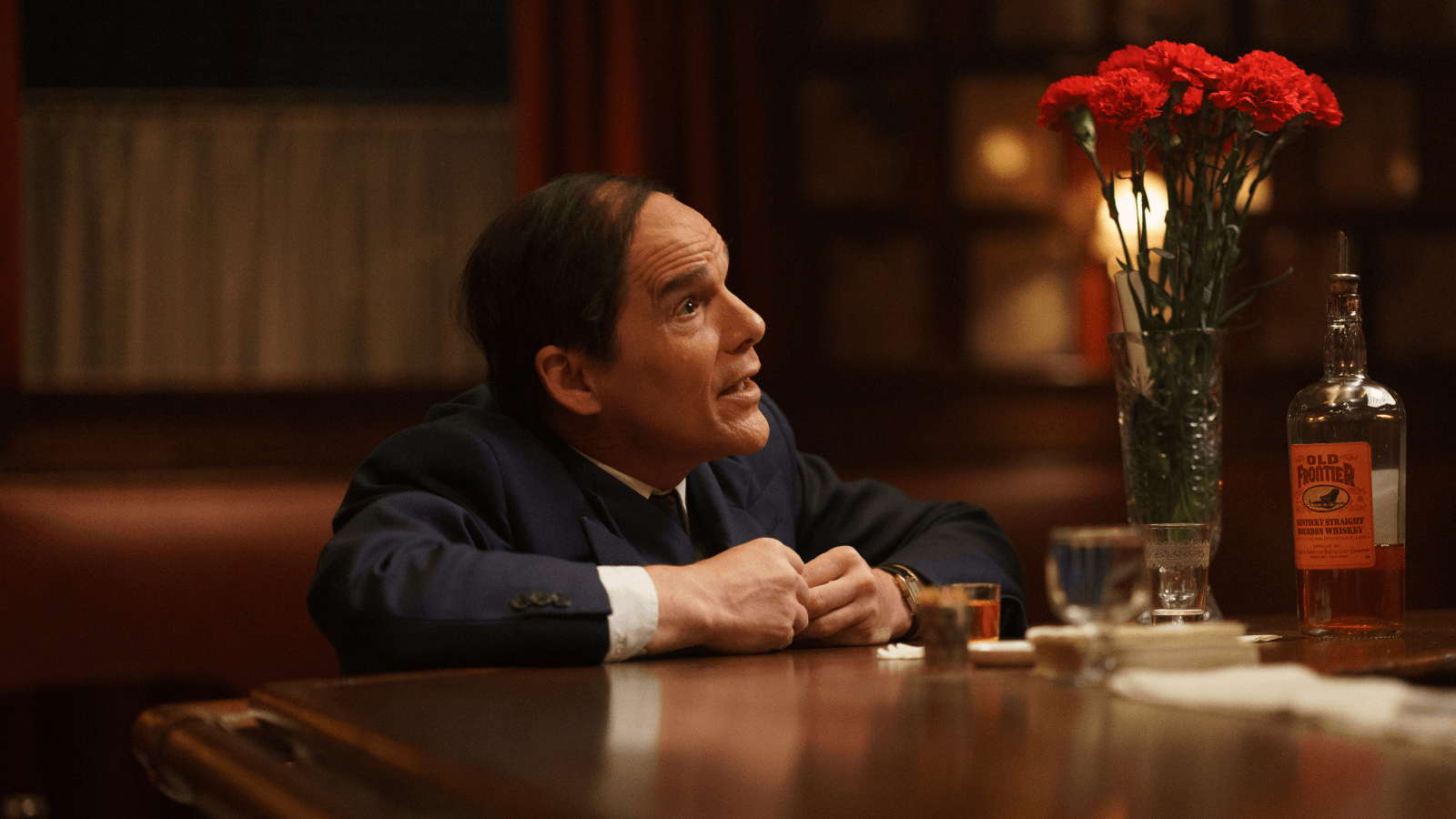 Ethan Hawke in Blue Moon, looking gross and tiny in his oversized suit and nasty slicked-back hair