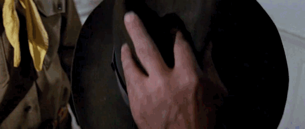 Gif of a hat being put on River Phoenix and then he looks up and it's Harrison Ford