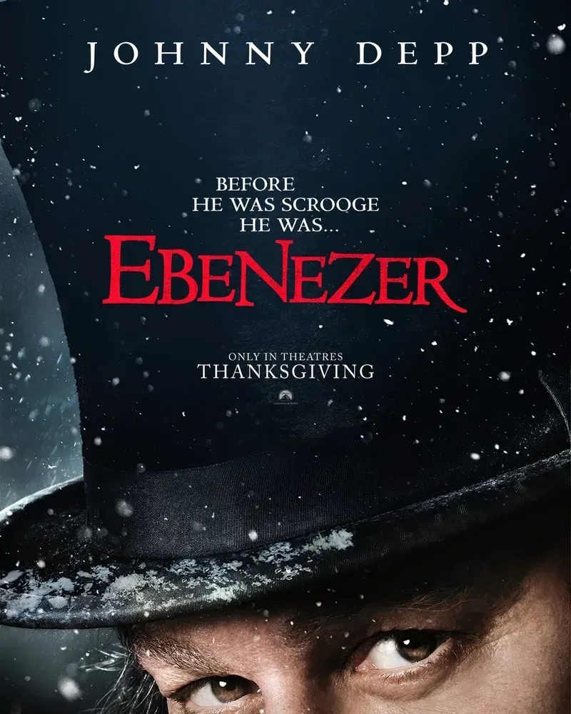 Film poster showing a black top hat, below which sit Johnny Depp's (gross) eyes. The tagline is "before he was scrooge he was" and the title is "Ebenezer"
