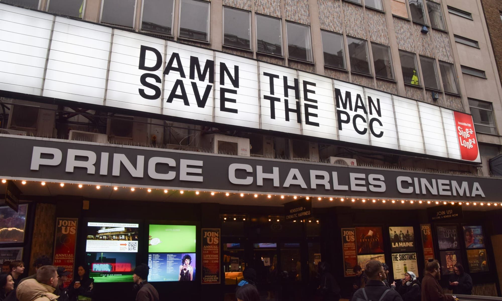 The sign of the Prince Charles Cinema, reading "Damn the Man, Save the PCC"