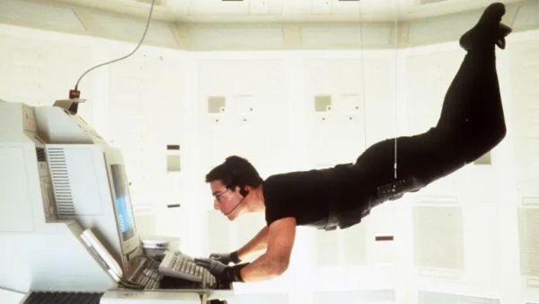 Tom Cruise dangles from the ceiling and tappy taps on the computer in Mission Impossible
