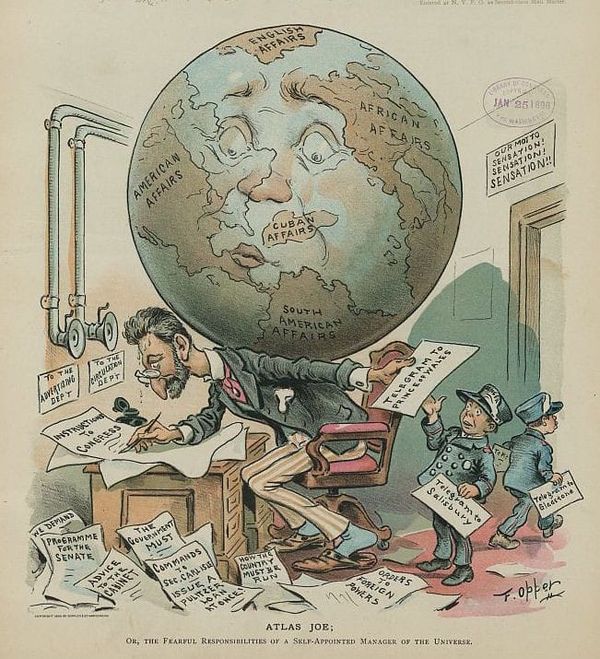 Cartoon of a harried man at a desk,  surrounded by papers, with the world on his back