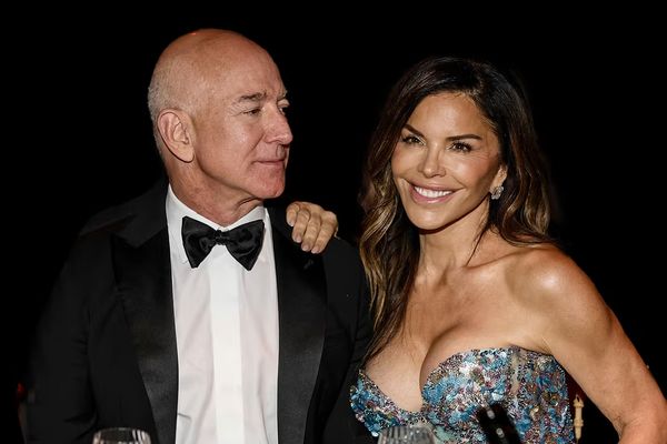 Lauren Sánchez leans on Jeff Bezos' shoulder while he looks at her
