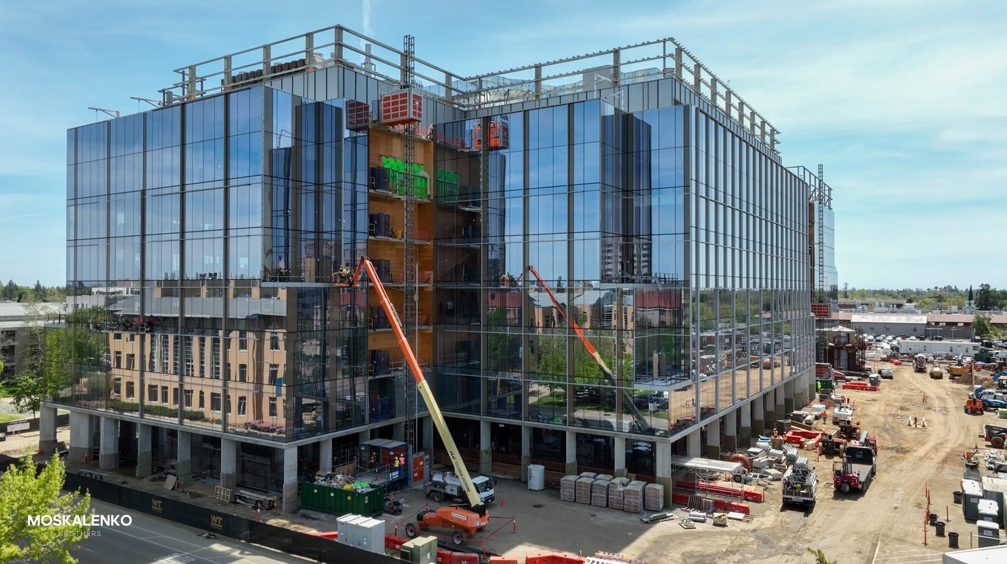 Image showing the Life Sciences building at Aggie Square during its glass panel installation.