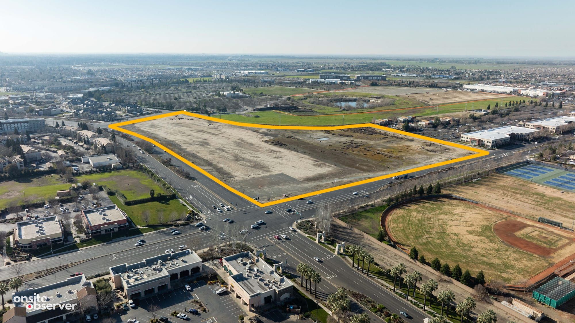 Aerial image capturing the approximately 27-acre site at the corner of Del Paso Rd and Truxel Rd. 