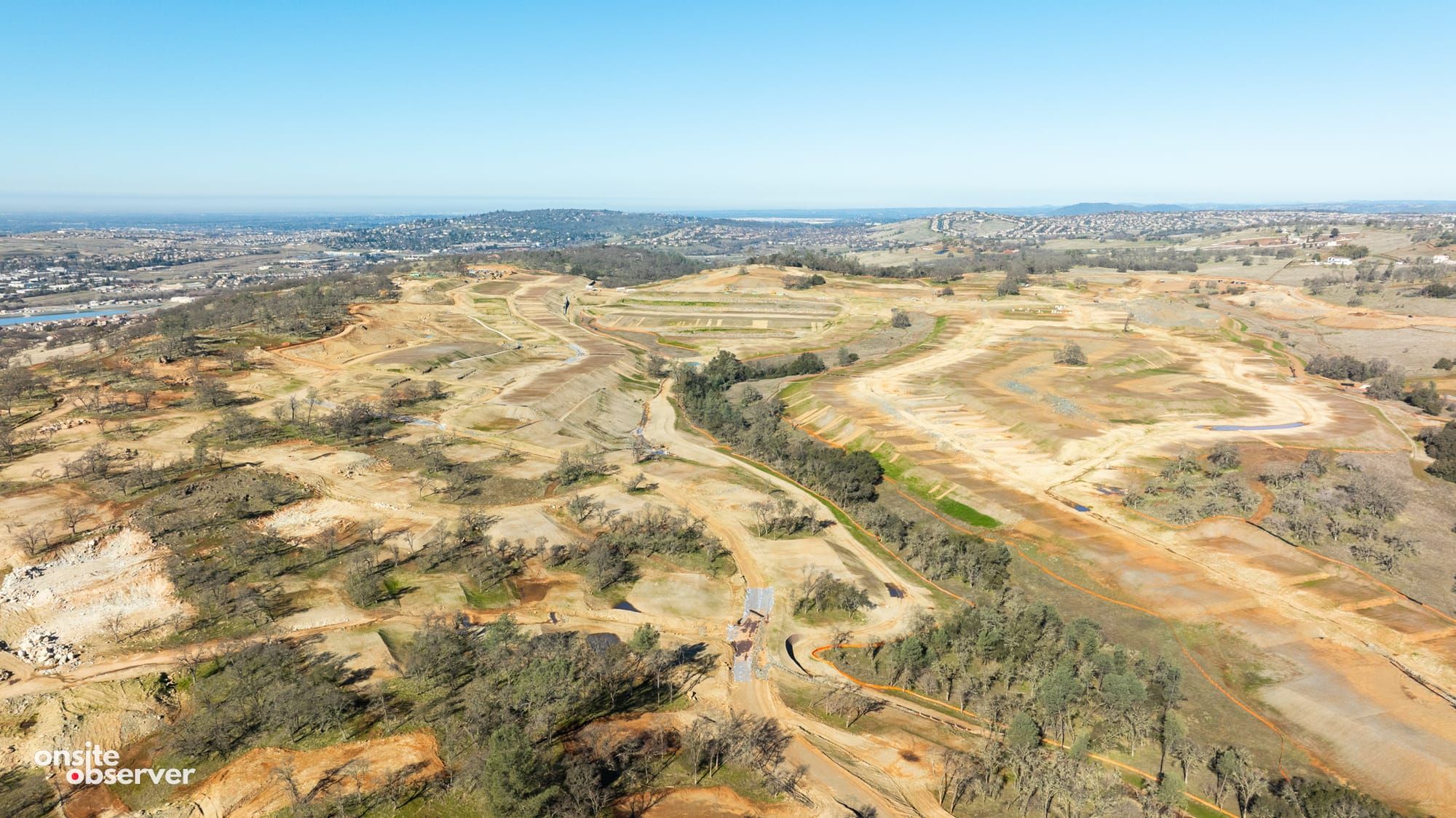 Aerial view showing ongoing infrastructure work at the 734-acre East Ridge Village, El Dorado Hills.