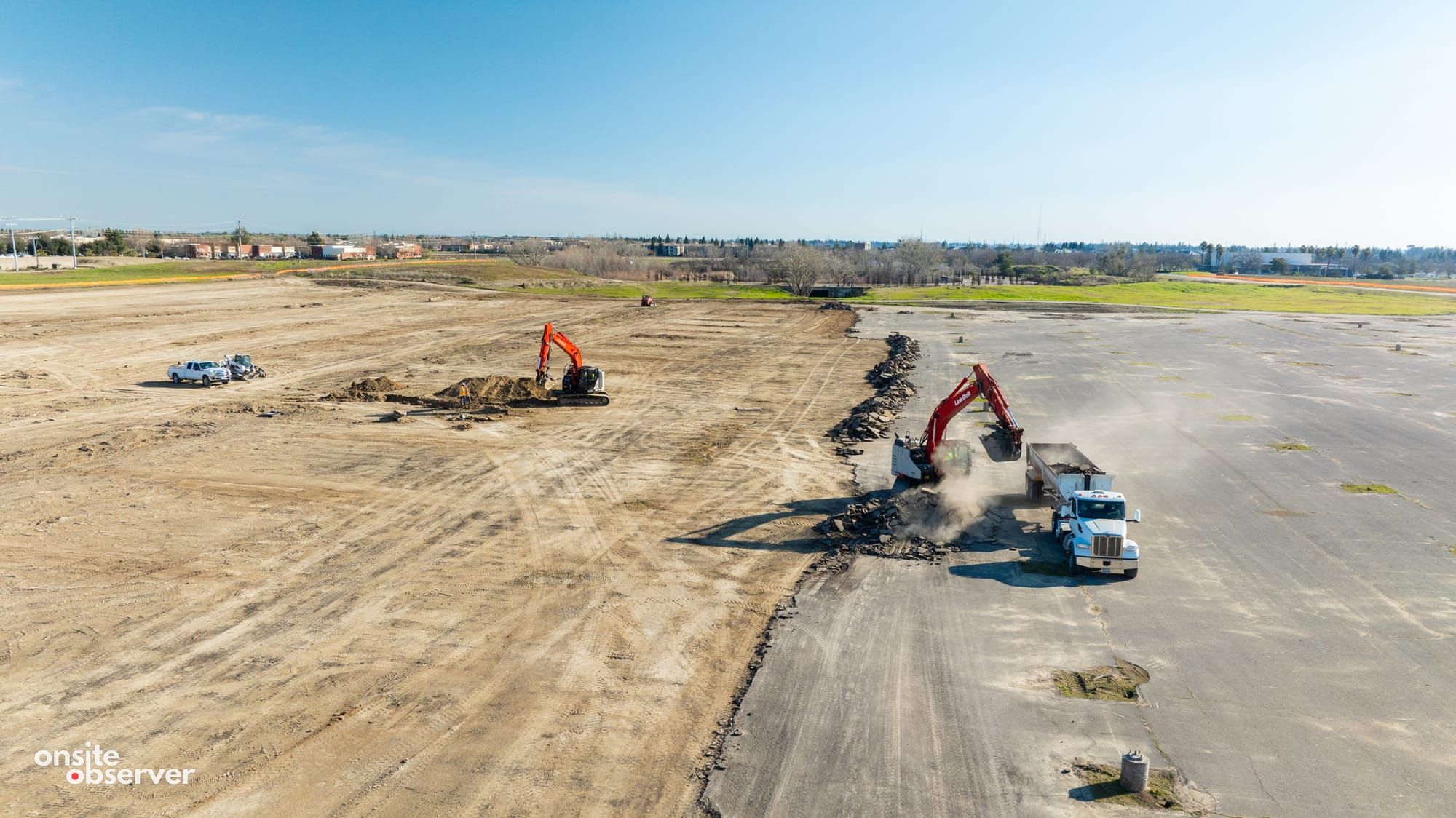 An aerial image capturing ongoing removal of old pavement and site preparation for the Innovation Park Project.