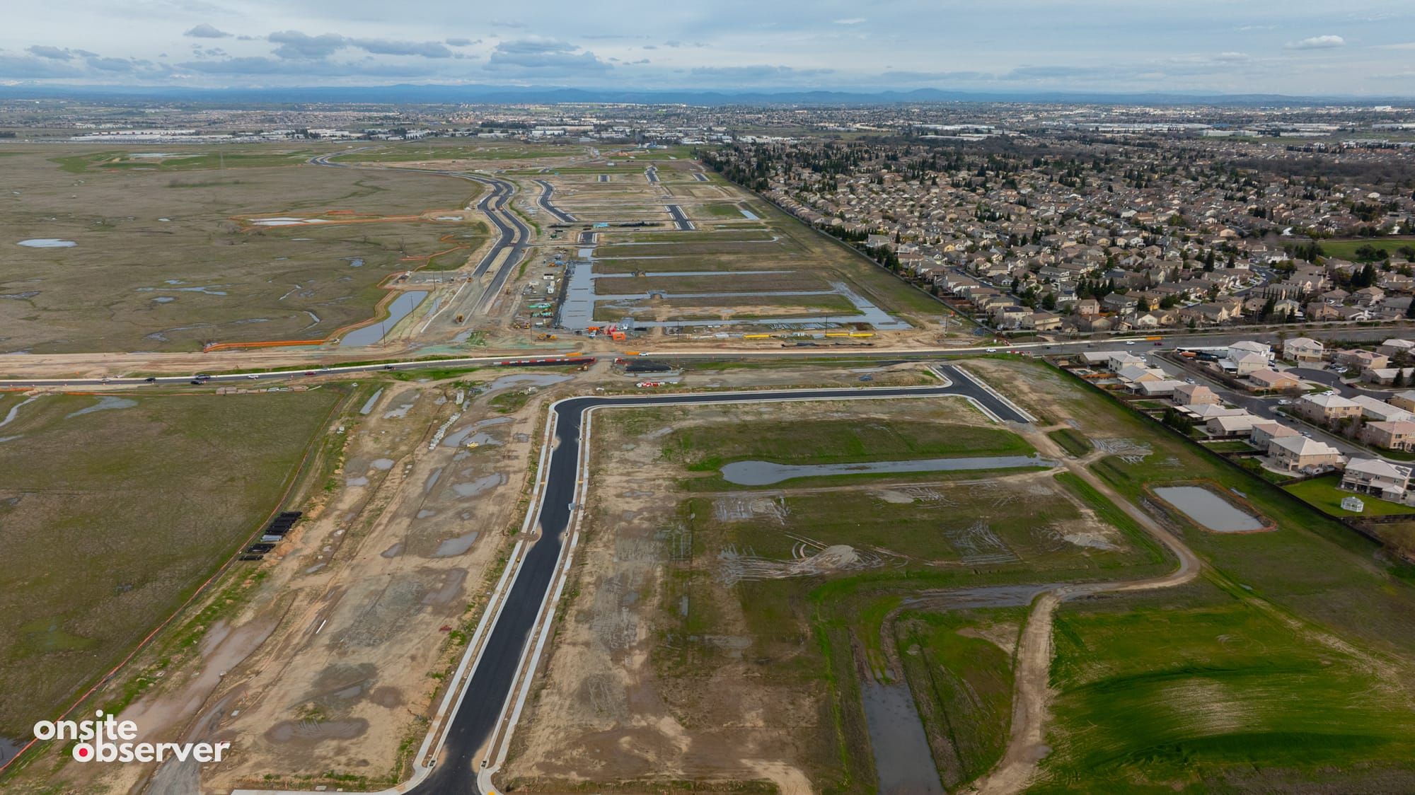 An aerial image showcasing the layout of newly paved roads within the first phase of the Placer One project.