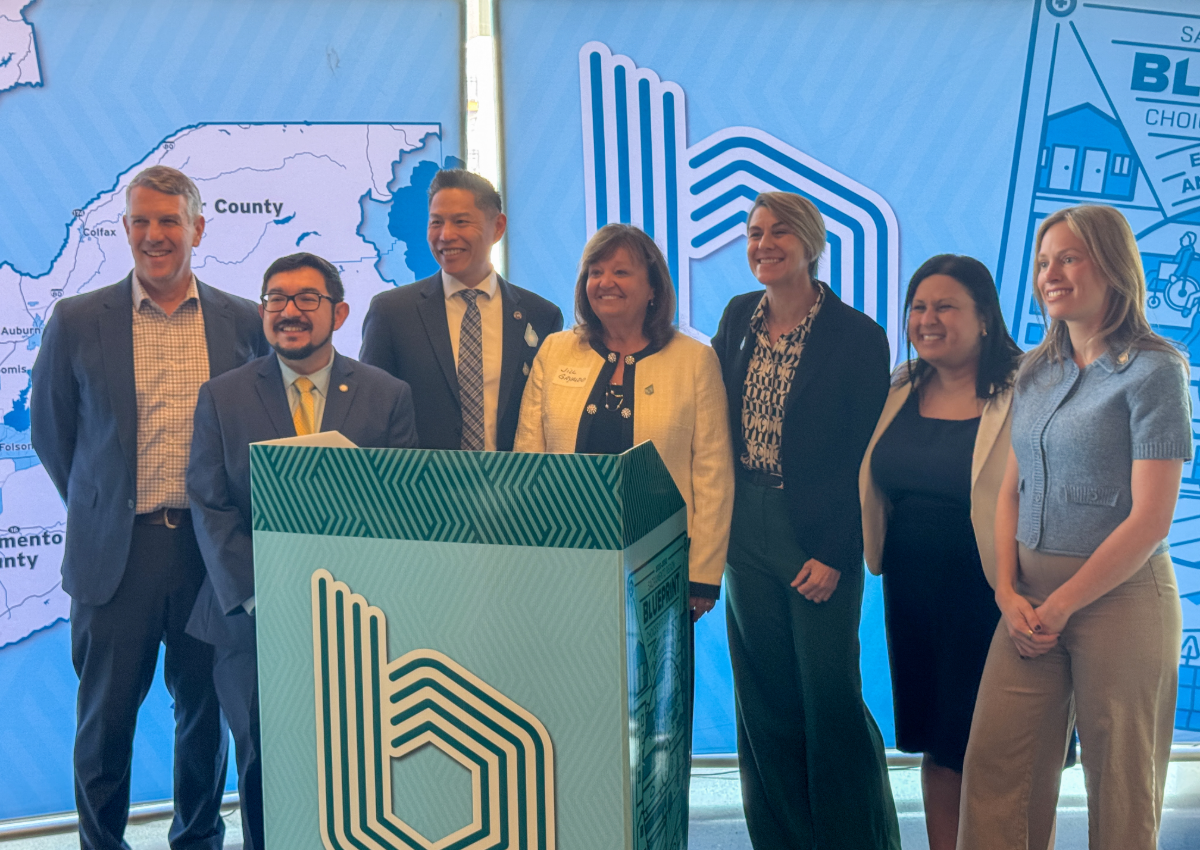 SACOG Board Chair Jill Gayaldo stands with regional leaders, including James Corless, Darren Suen, Caity Maple, Eric Guerra, Evan Schmidt and Cathy Rodriguez.